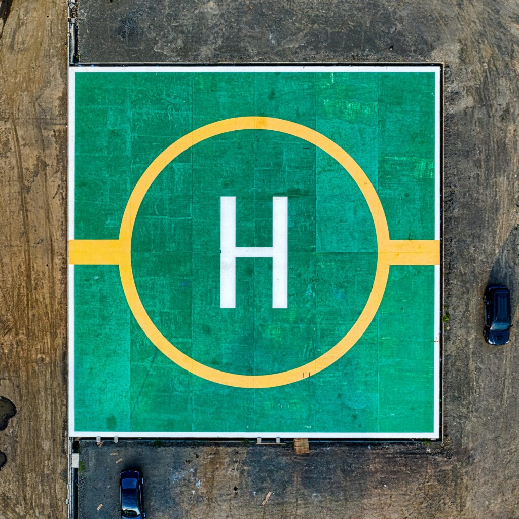 Top-down view of a colorful helipad in Jakarta, showcasing bold geometric design.